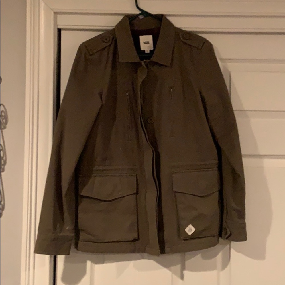 Zip up army jacket with buttons. Plaid interior